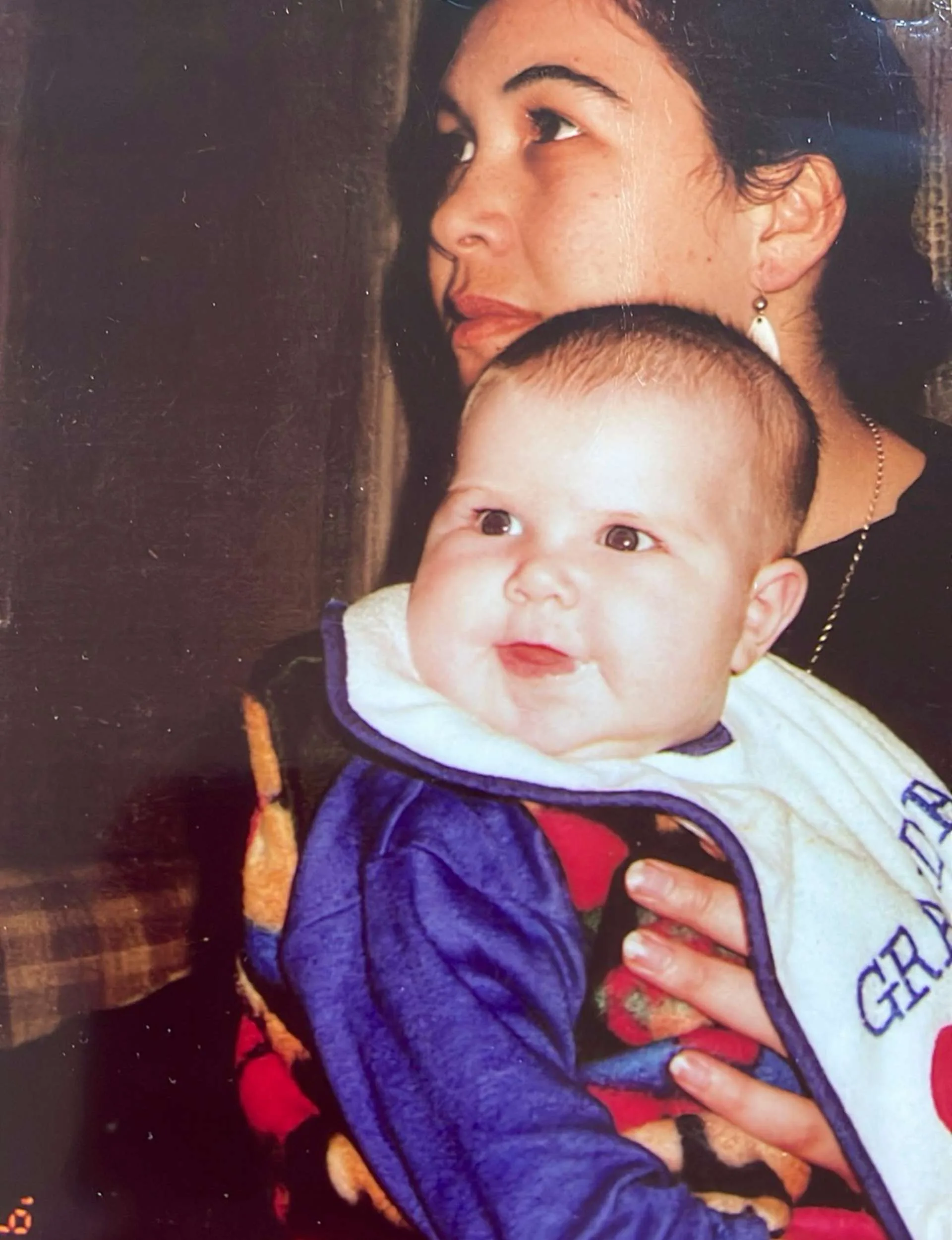 Rawinia Higgins holding her baby when they were both young