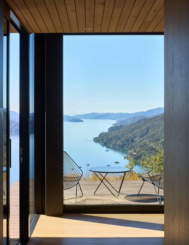 Floor-to-ceiling Vantage window with outdoor seating outside and views of Queen Charlotte Sound