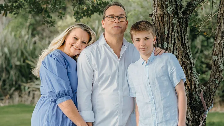 Kris Edwards with his family in a park