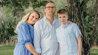 Kris Edwards with his family in a park