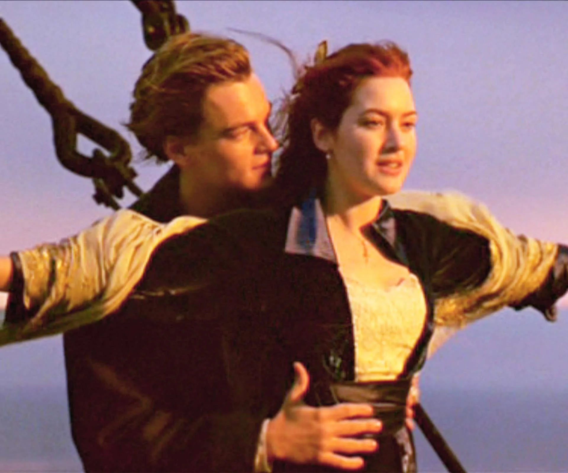 Leonardo DiCaprio with Kate Winslet in the famous Titanic pose on the front of the boat