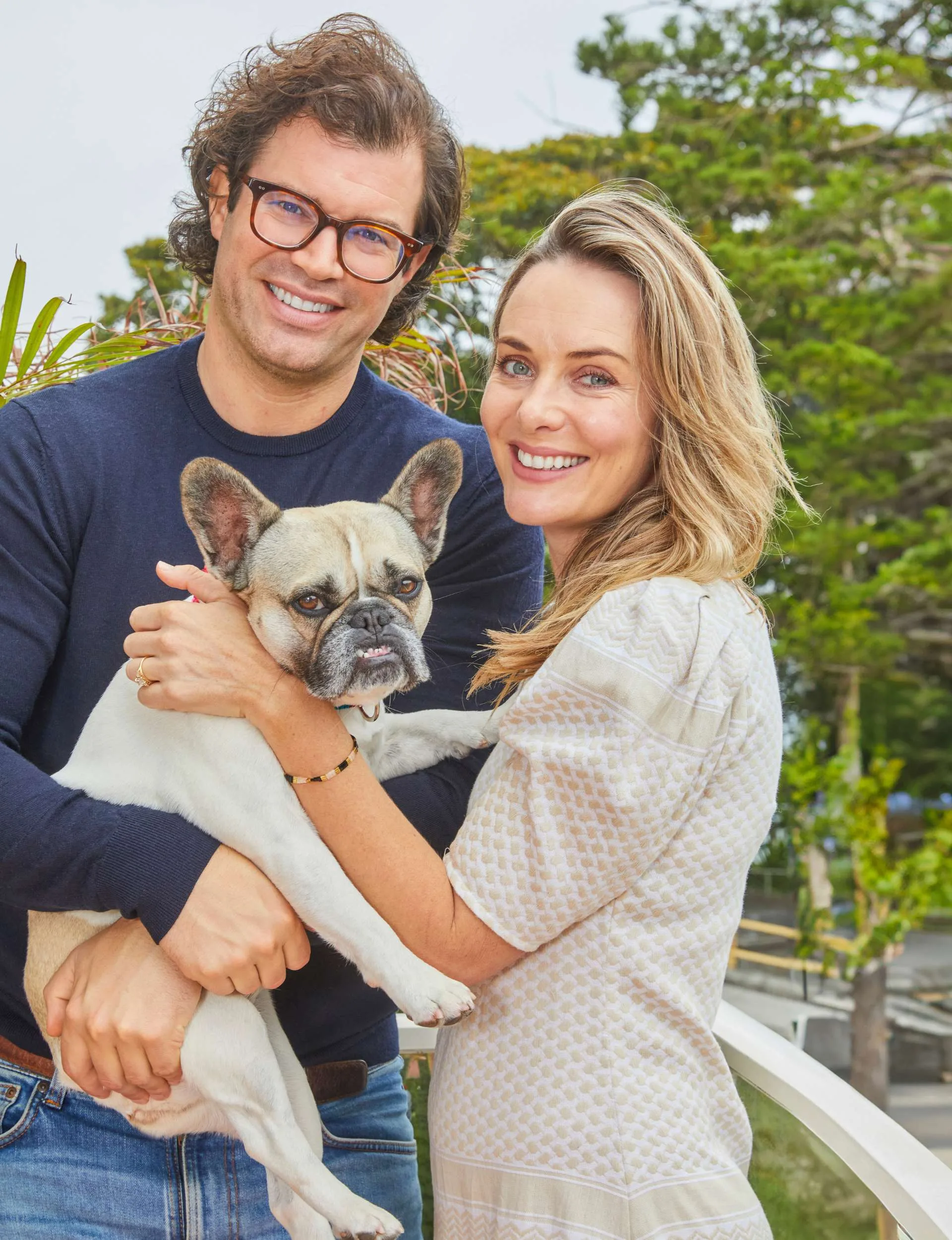 Emma Leonard and partner Conor Nix holding their puppy Luna