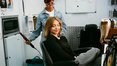 Sydney Sweeney's hair being styled with the Dyson Airwrap