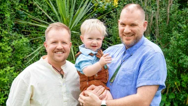 Frankie and Rawa holding their son