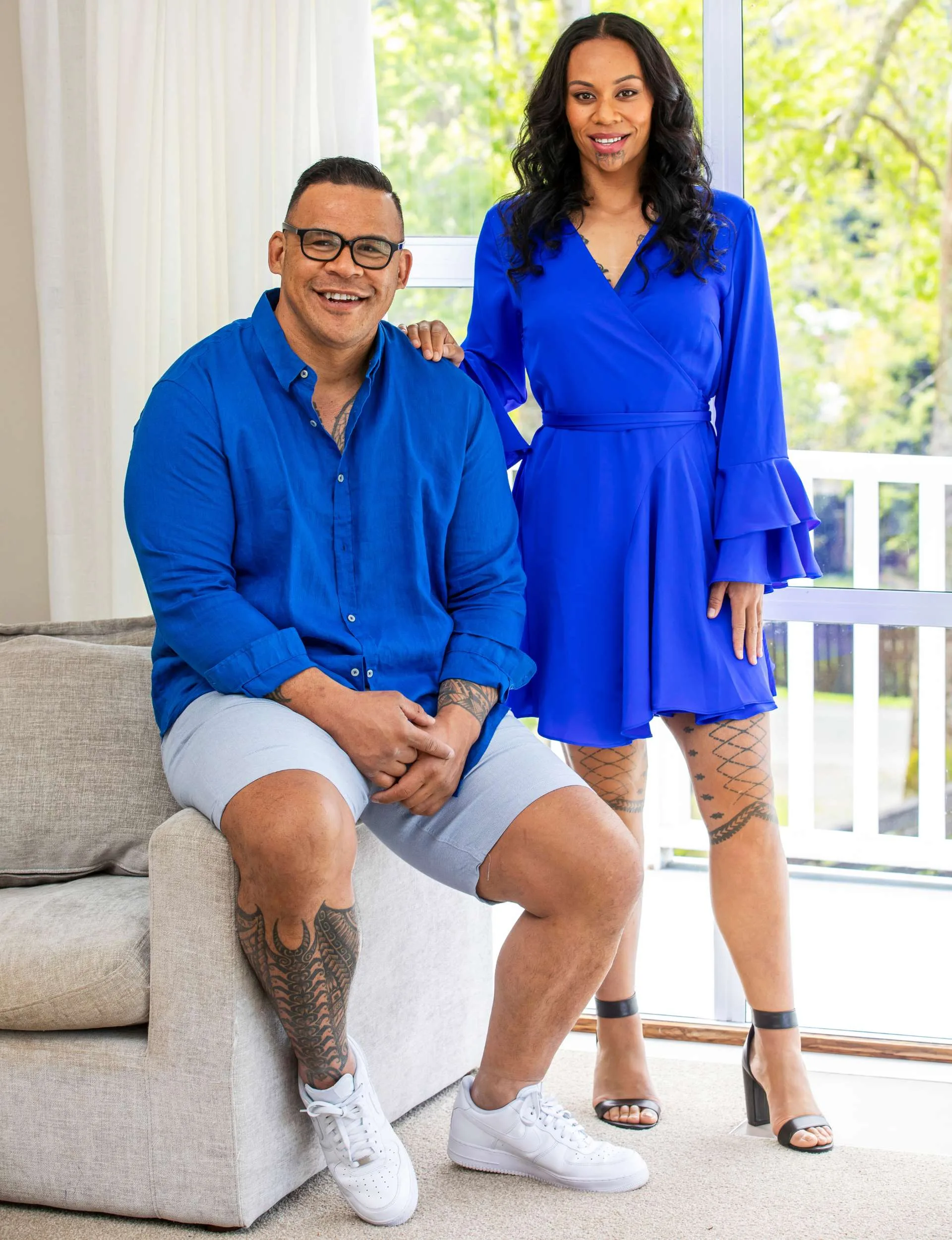 Dave Letele with sister Meripa, both wearing bright blue