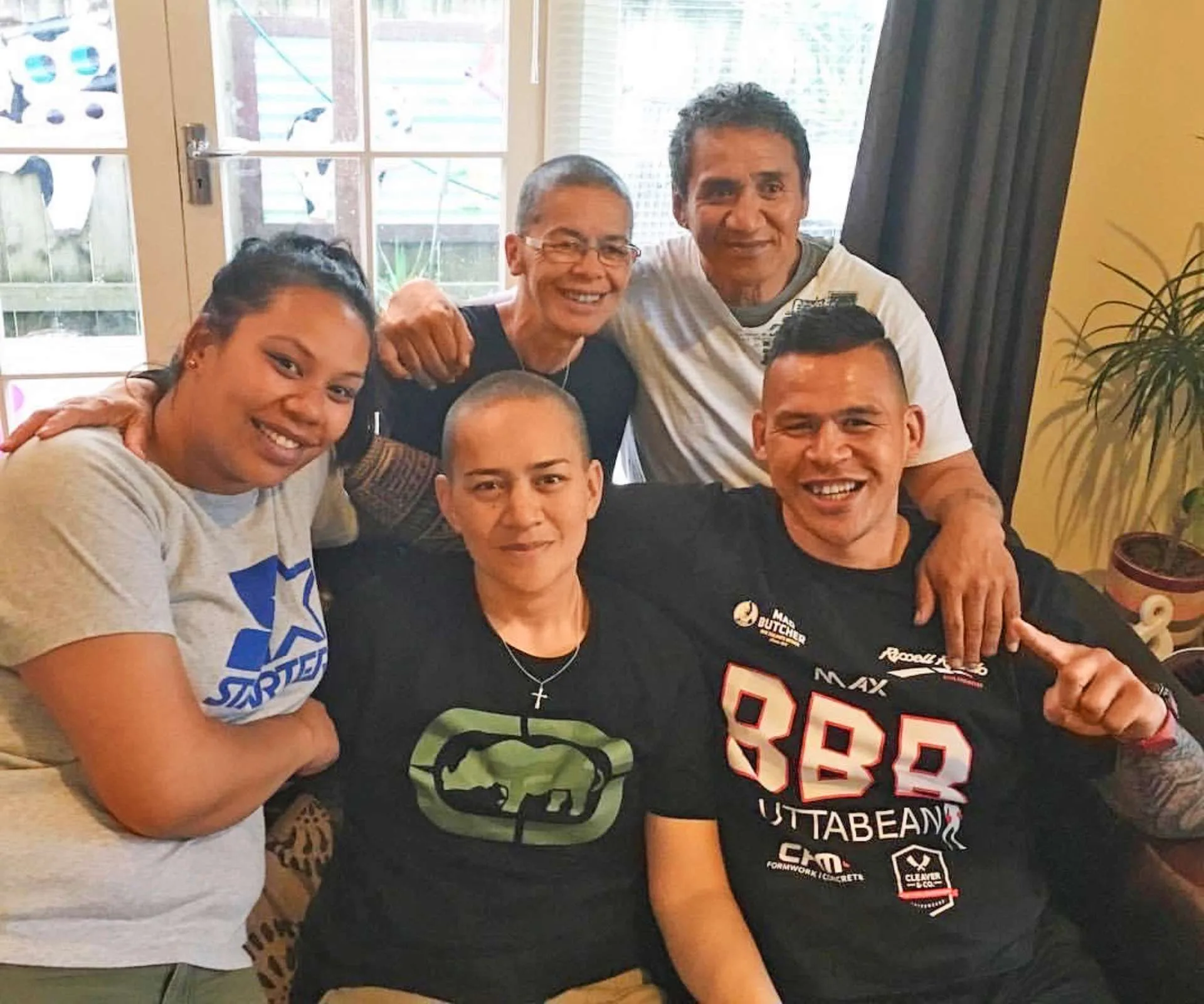 Dave Letele with Meripa and their other family members on a couch