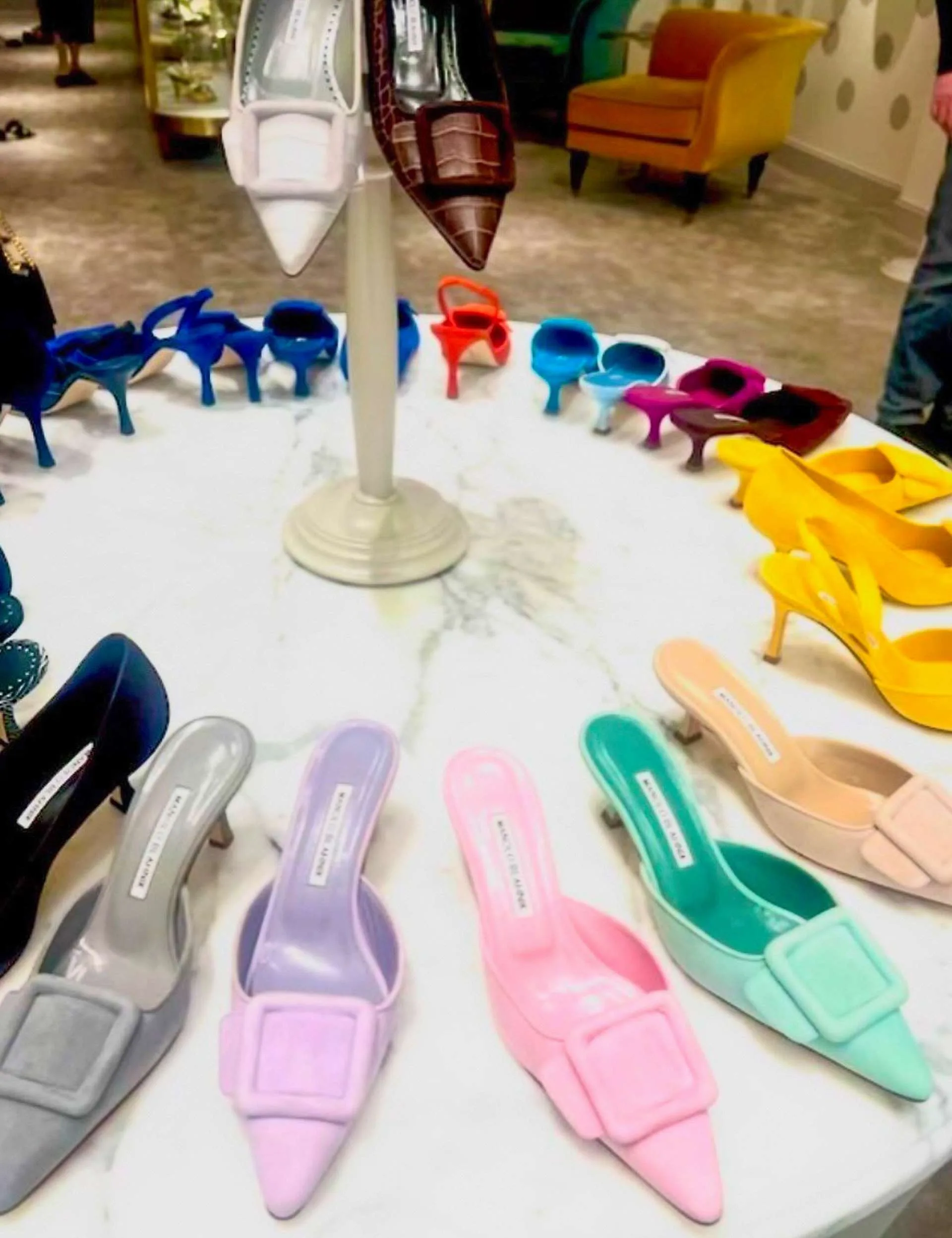 A table covered in coloured high heels