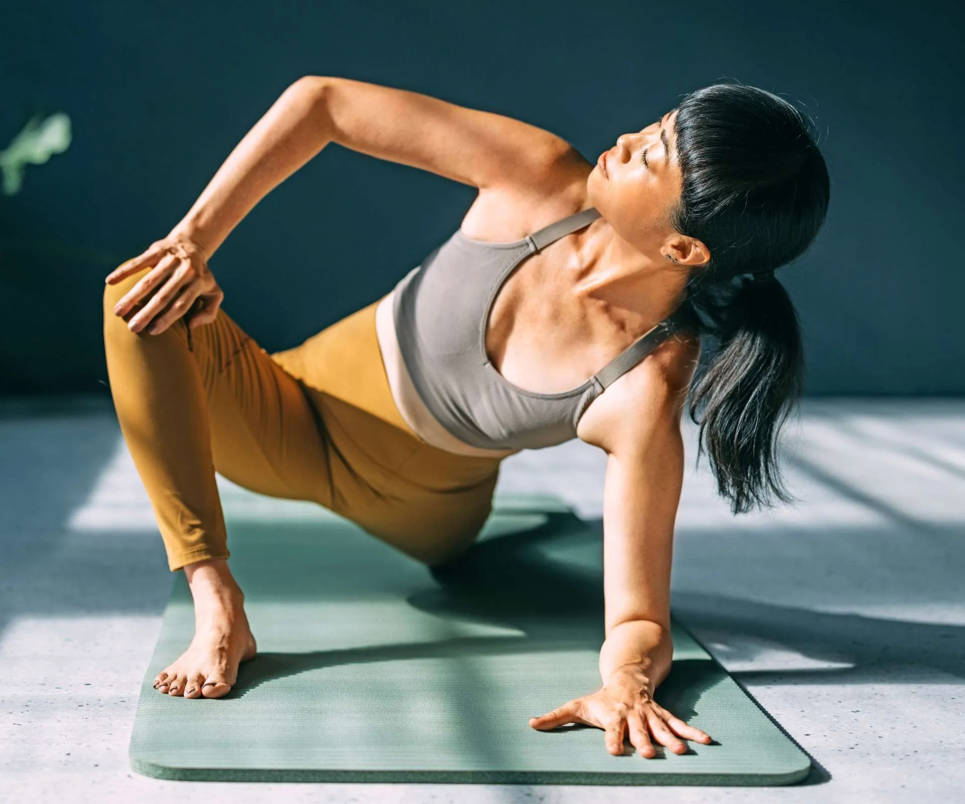 A woman doing yoga to prevent burnout