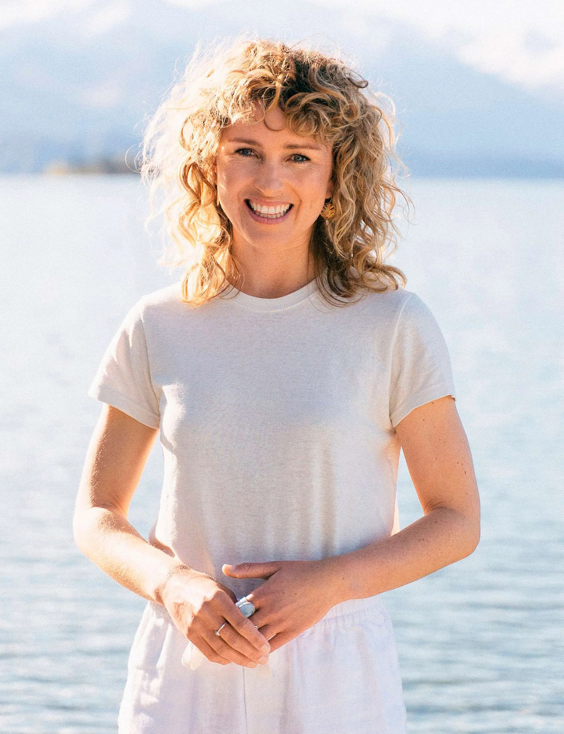 Isobel Ewing standing in front of a body of water