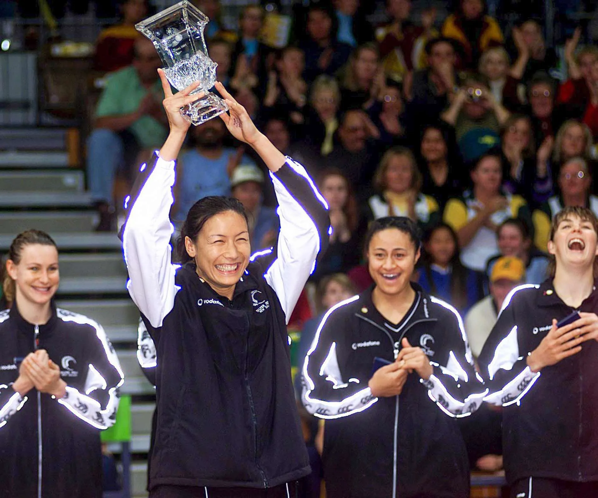 Holding up a trophy with her former Silver Ferns teammates