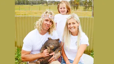 Ashlee and her parents with a wombat