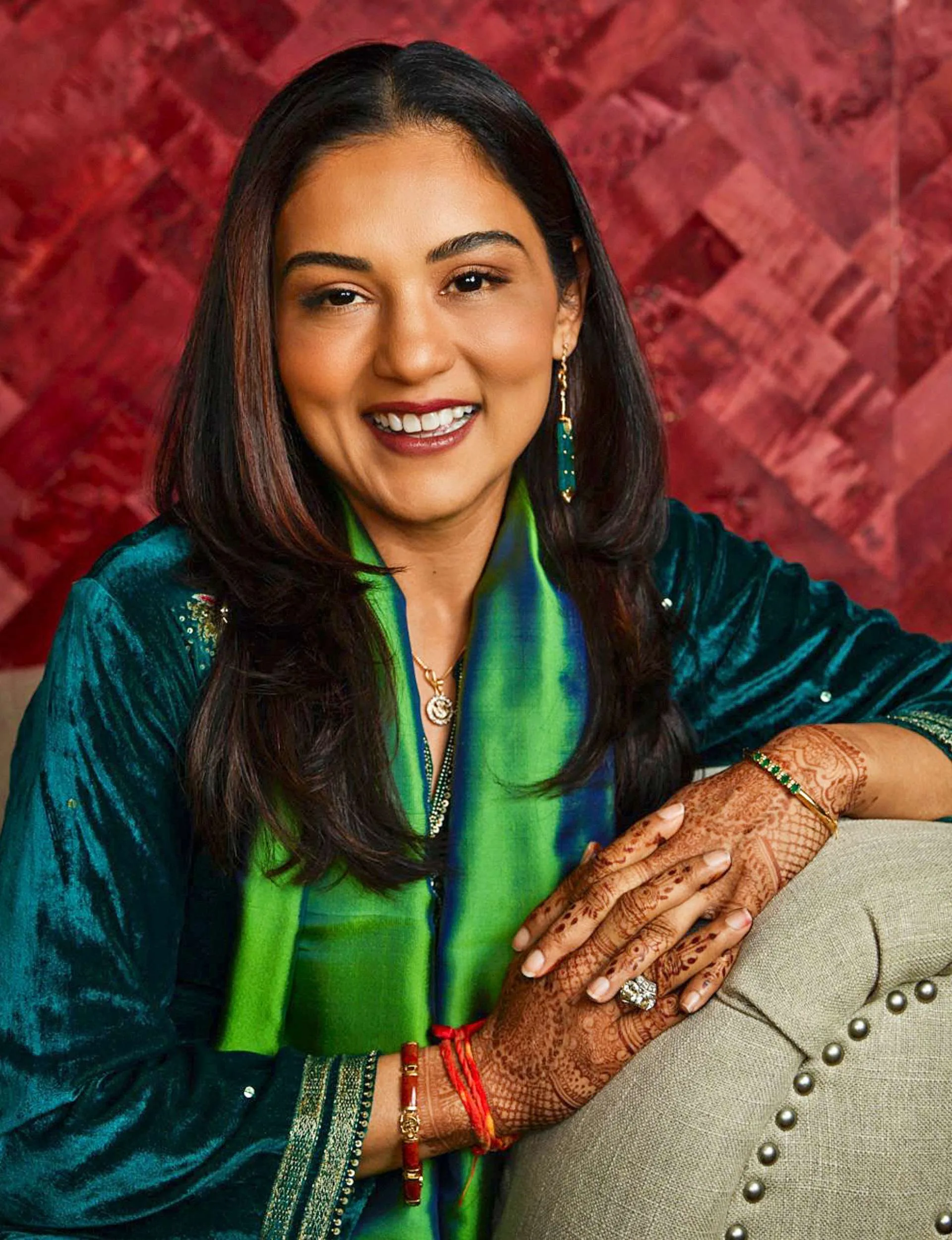 Princess Padmaja leaning on the arm of a couch