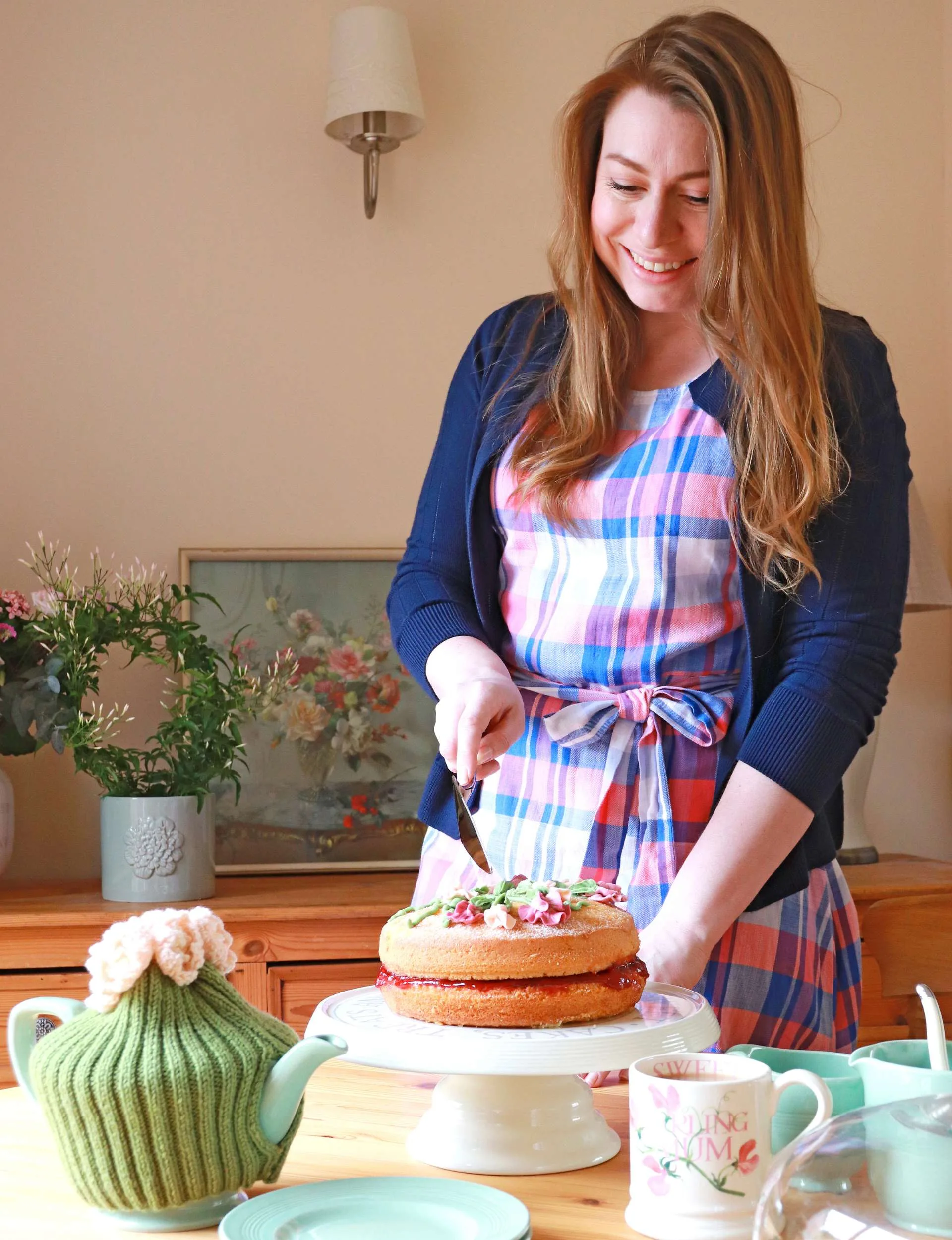 Trad wife Alena cutting a cake