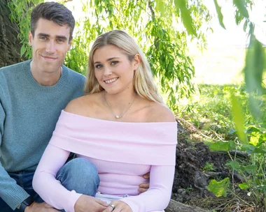 Hamish Kerr with his girlfriend, Maddie sitting under a tree