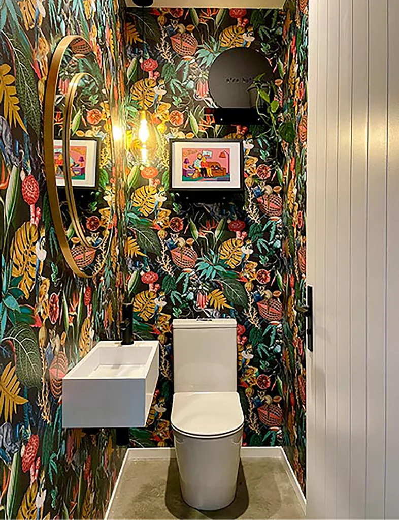 Colourful tropical wallpaper in powder room