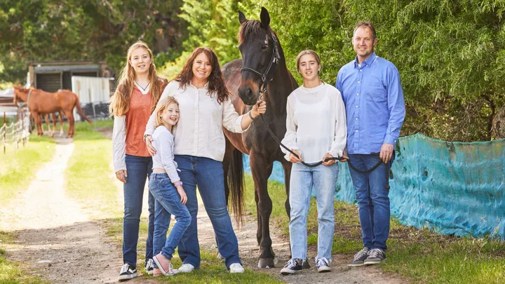 Isla van der Westhuizen with her family and horse Kygo