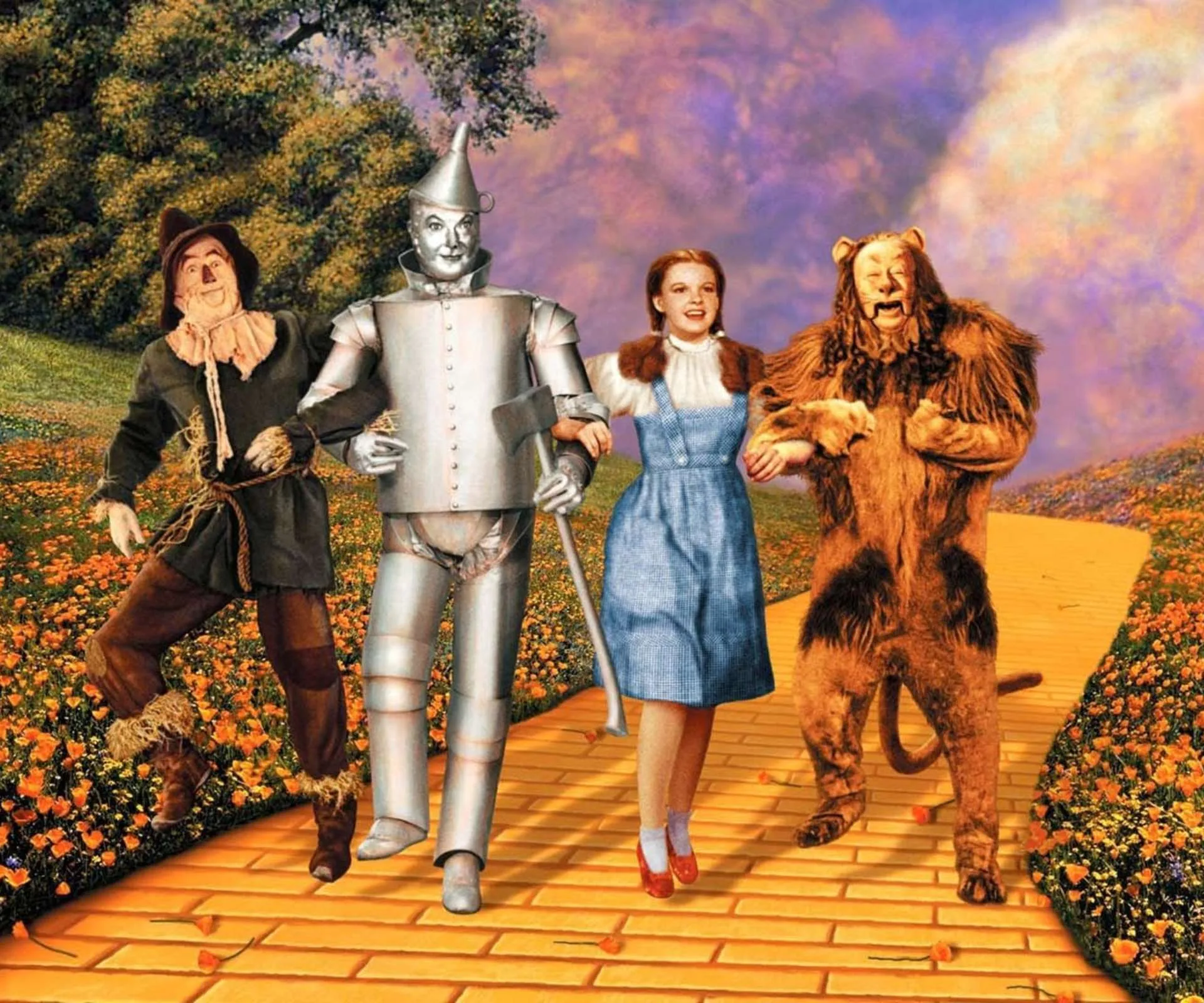 The cast of the original Wizard of Oz skipping down the yellow brick road