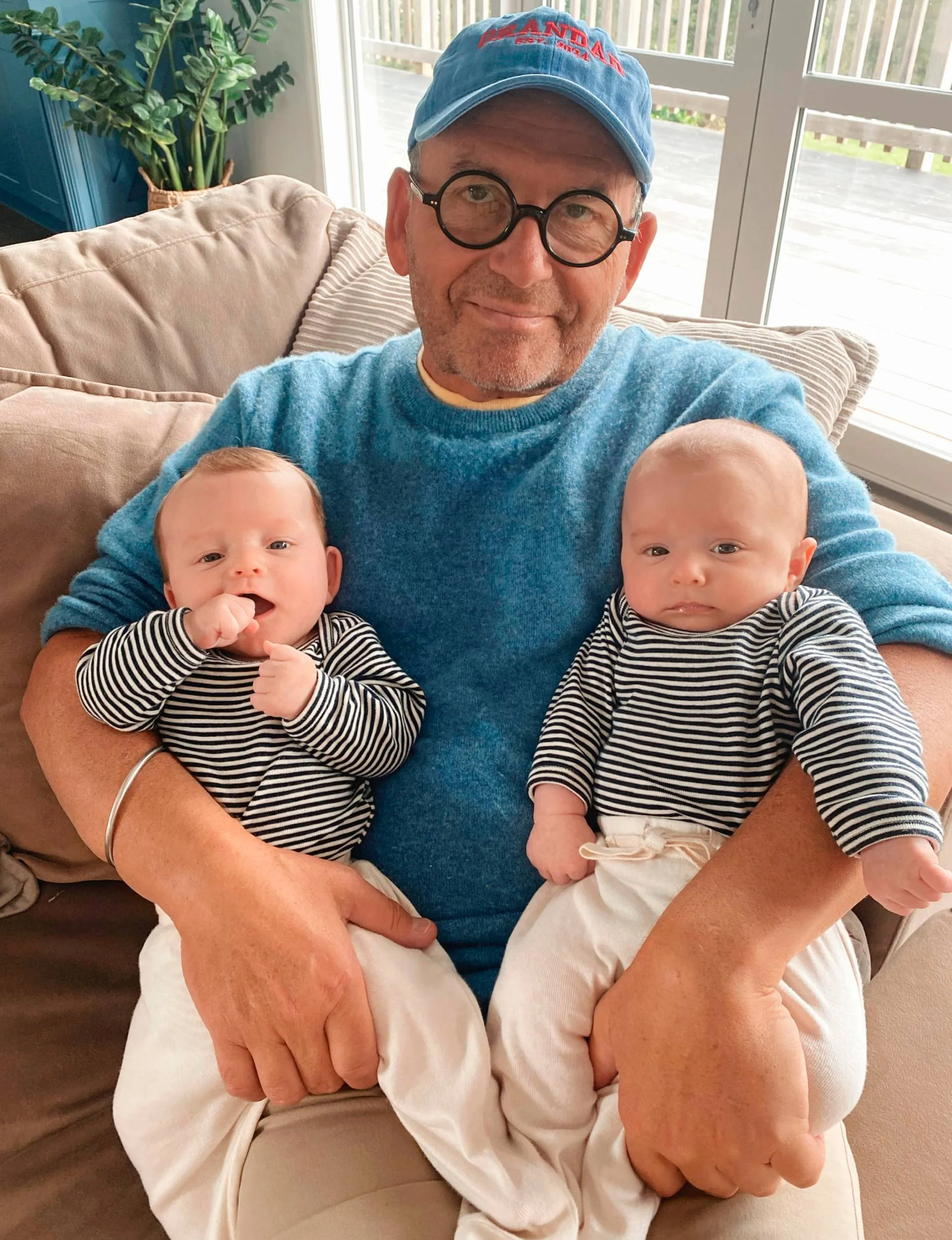 Paul Henry holding his grandsons Walter and Darcy