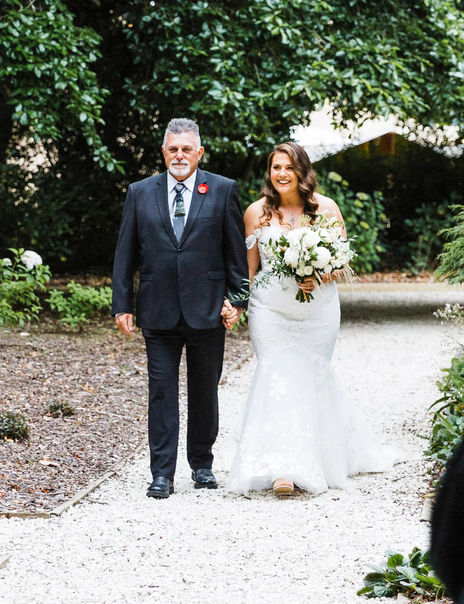 K'Lee and her dad walking down the aisle