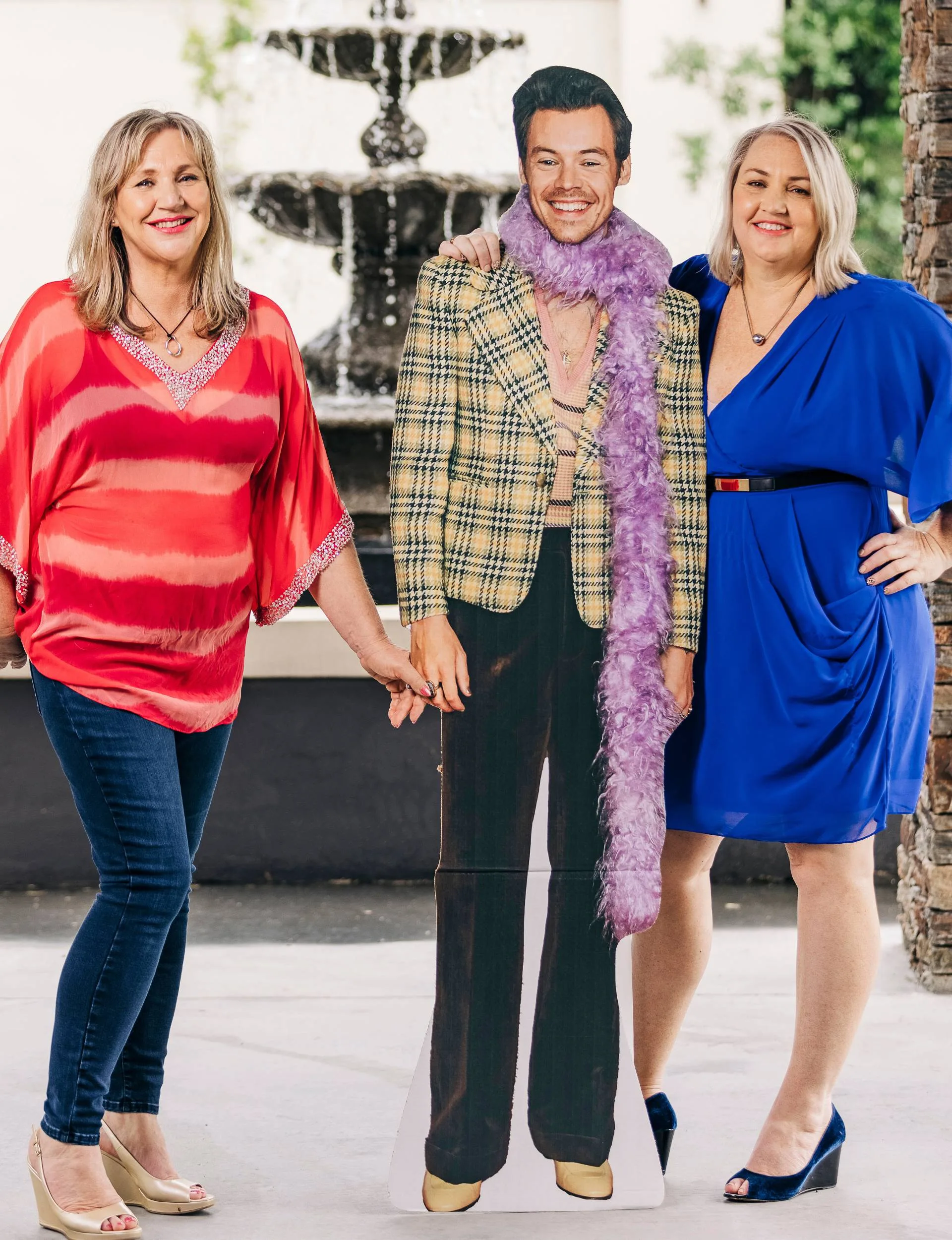 Kirsty and Nikki standing with a cardboard cut out of Harry Styles