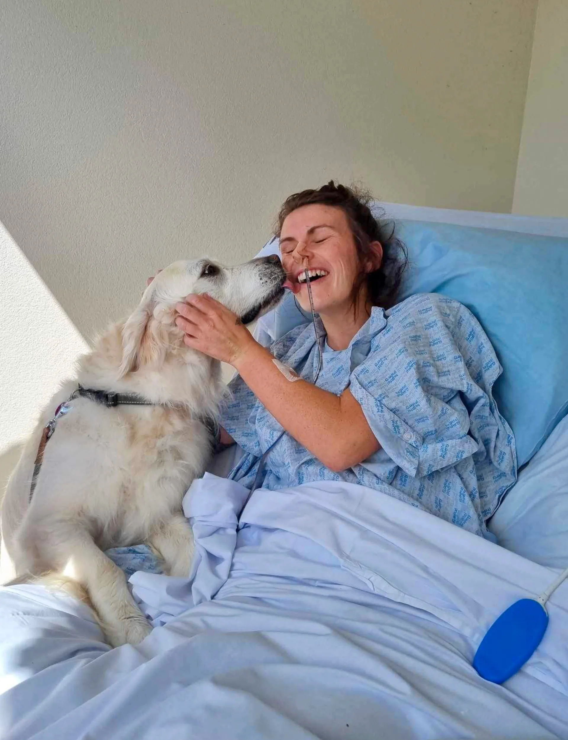 Hayley-Marie Bushby with her dog Bailey in hospital