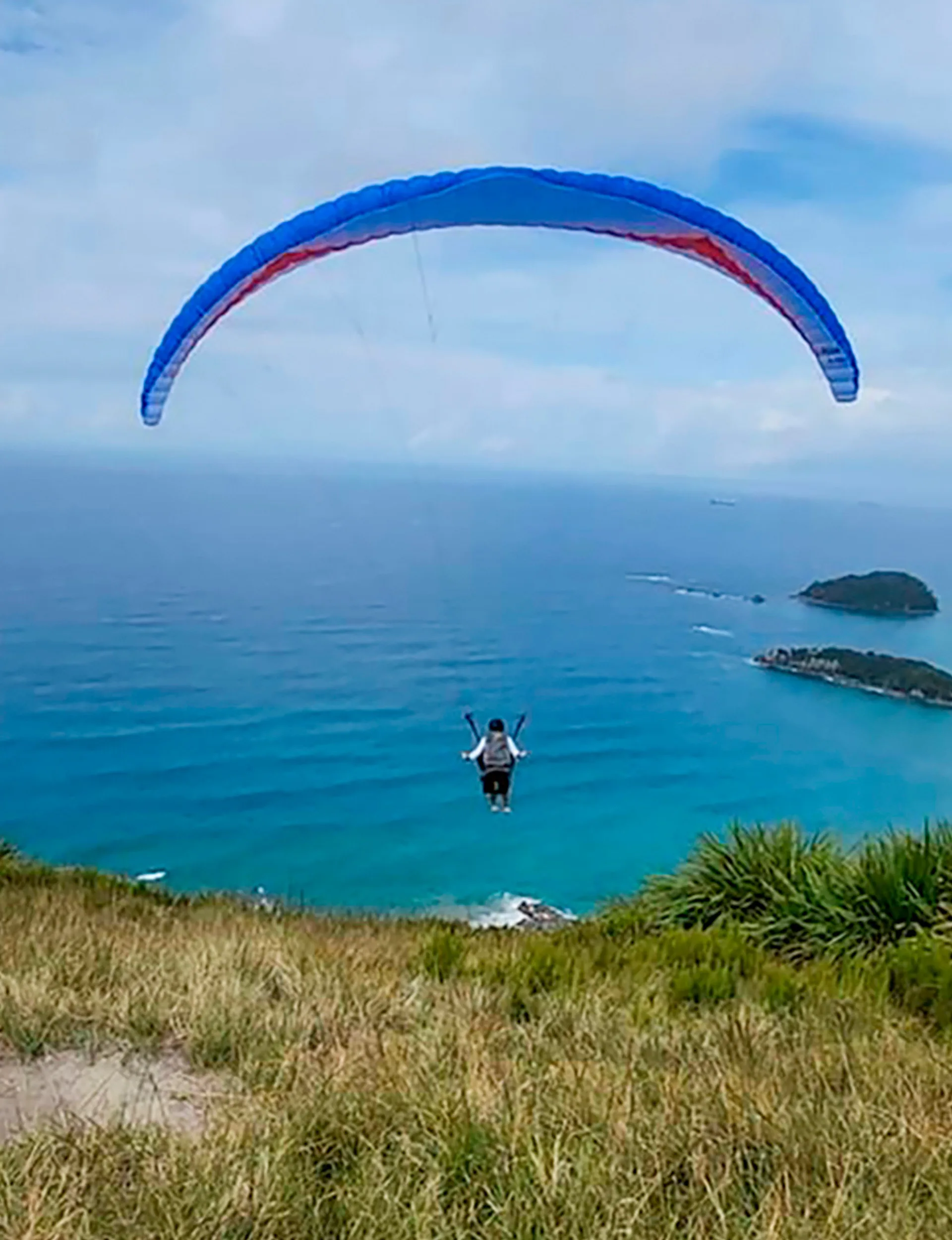 Hayley-Marie paragliding off Mount Maunganui