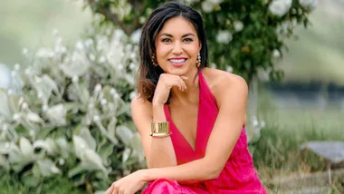 Nadia Lim smiling in a bright pink dress