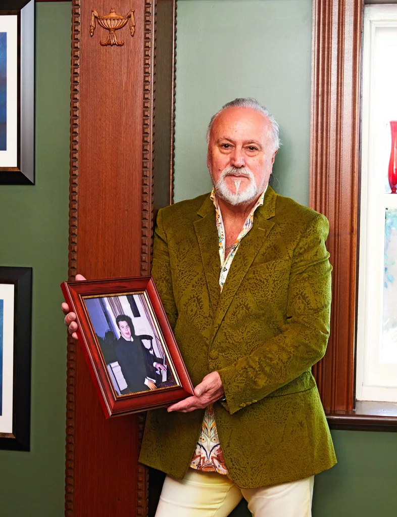 Joe Giardina holding a photo of his son, who died in the 2004 Tsunami