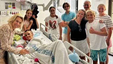 Artaban de Lacharriere in hospital surrounded by family