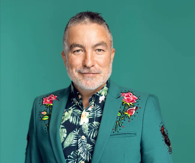 man wearing green suit with green background