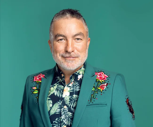 man wearing green suit with green background