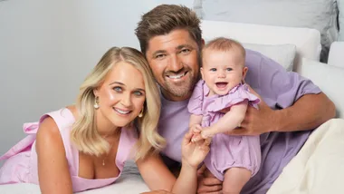 Woman's Day photograph of Rebekah Randell, her husband and their baby who was born in 2024