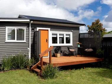 Shed turned into house, orange and black