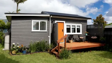 Shed turned into house, orange and black