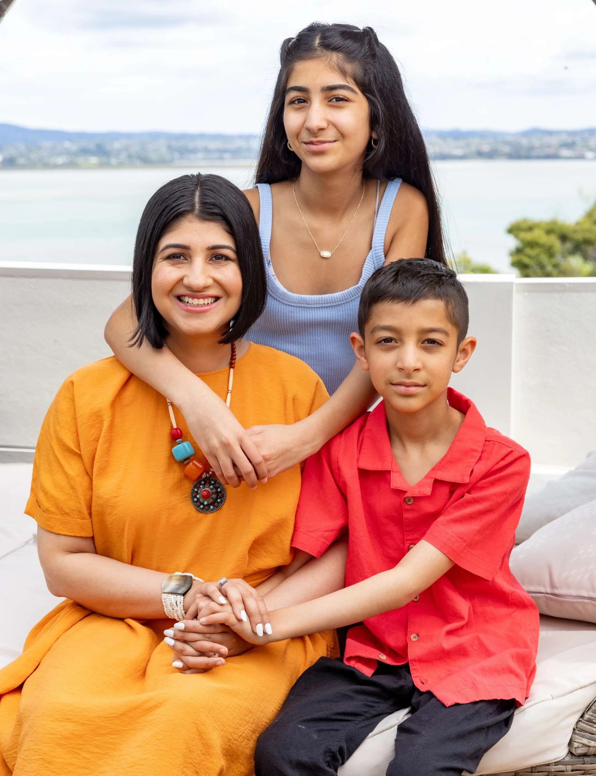 Indian family with a view behind them