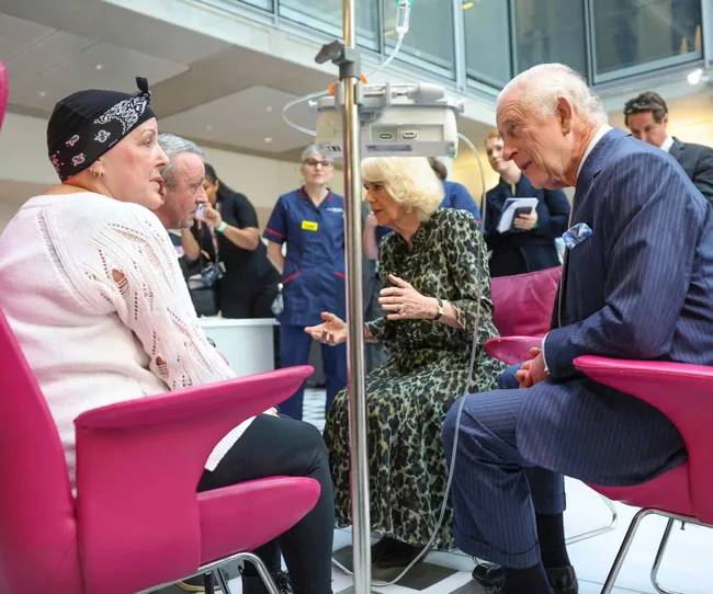 King Charles talking to cancer patient