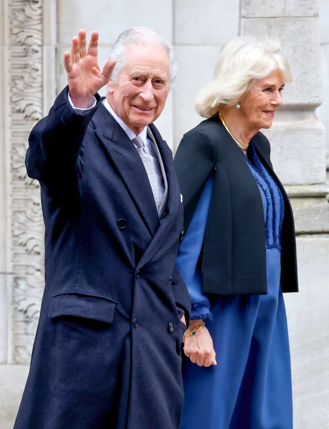 King Charles and Queen Camilla waving