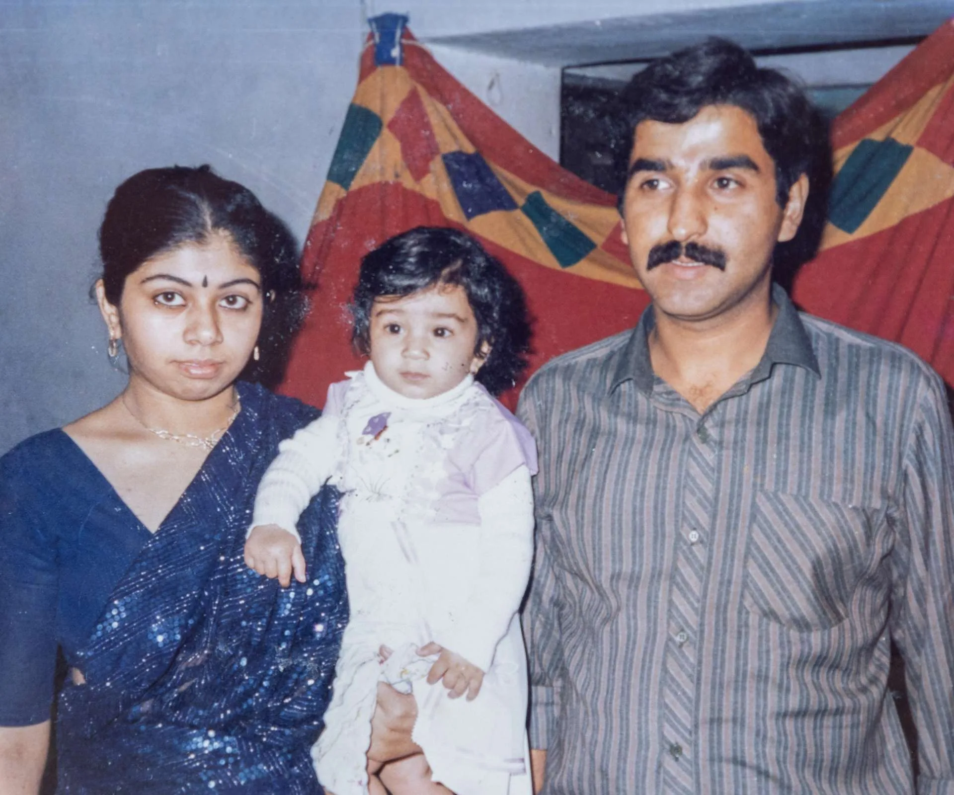 Two Indian parents with their baby