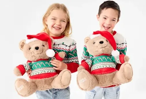 children holding kmart kenzie christmas bears