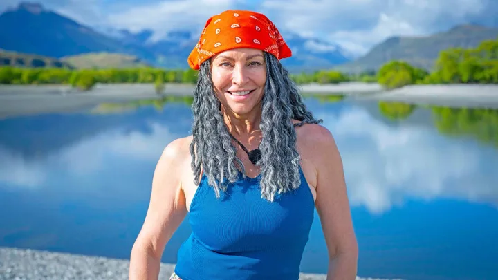 The Summit star Simmone in front of a lake