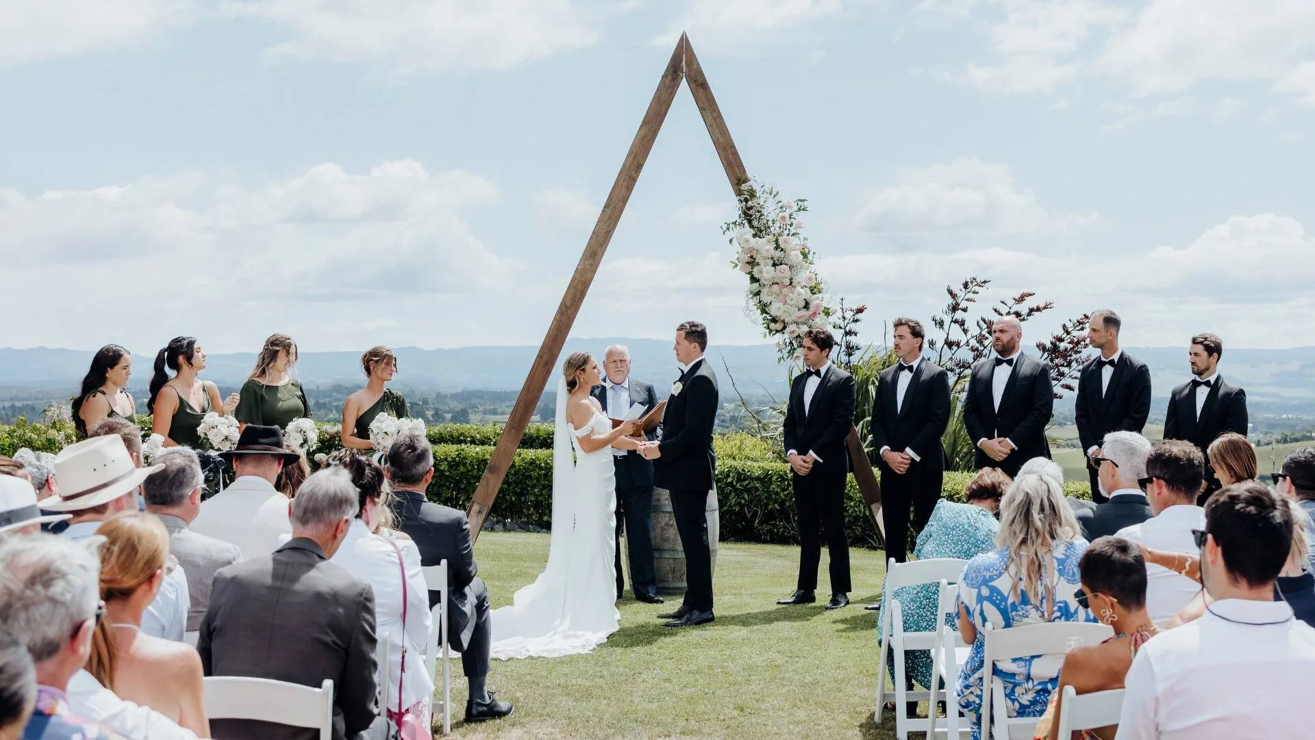 Exchanging vows overlooking a hilltop view