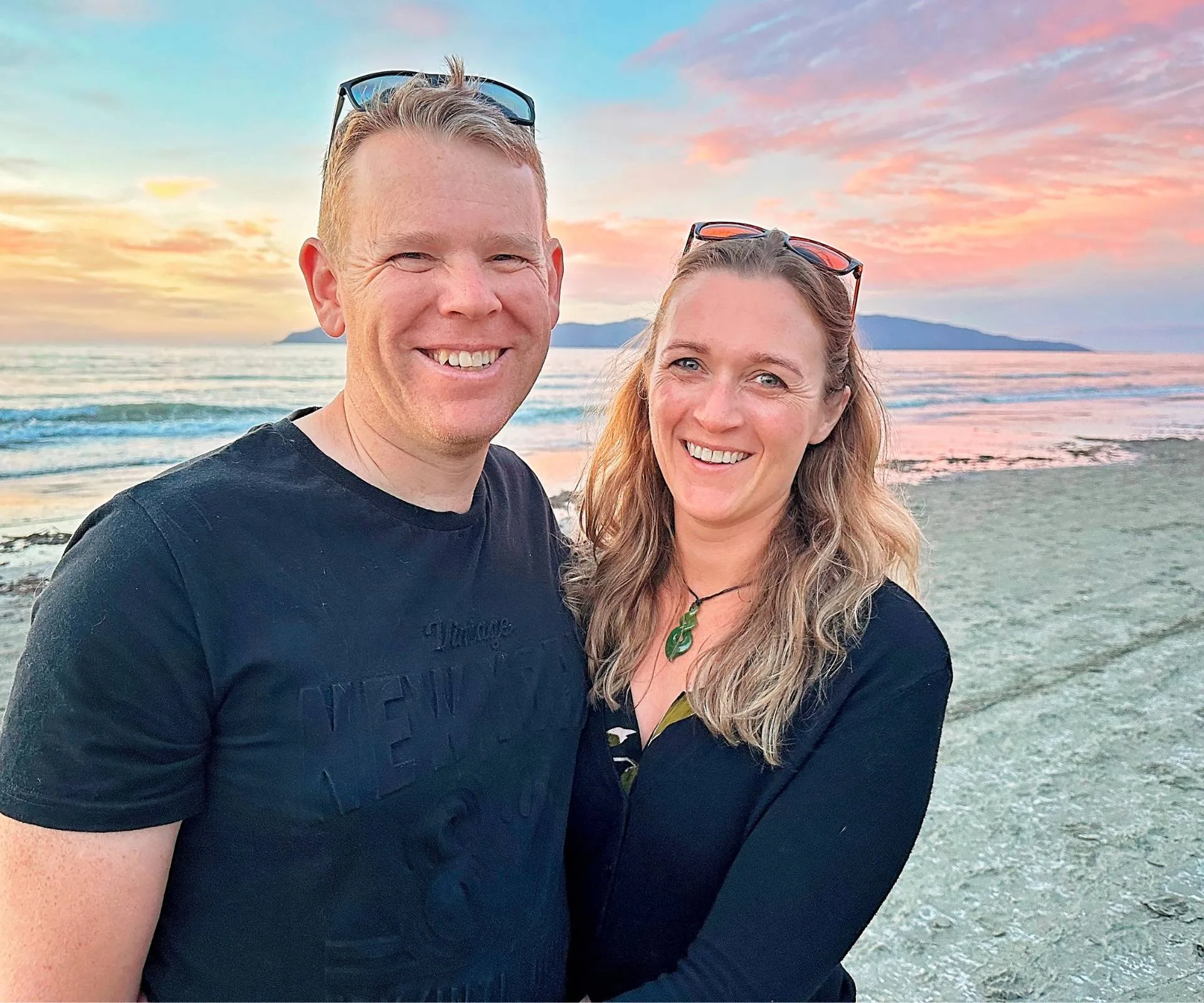 Chris and Toni on a beach at sunset