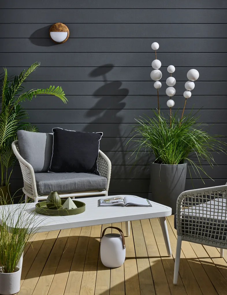 Darker colours can make an outdoor space look more luxurious