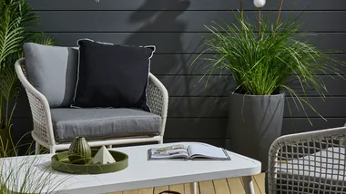 Dark colours bring luxury to outdoor room