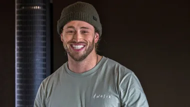 Joshua Fankhauser smiling in a gym