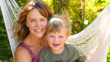 Ria Vandervis sitting on a hammock with her son, Teddy