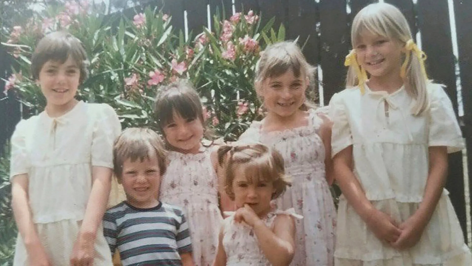 Alex Lang as a child with other young family members