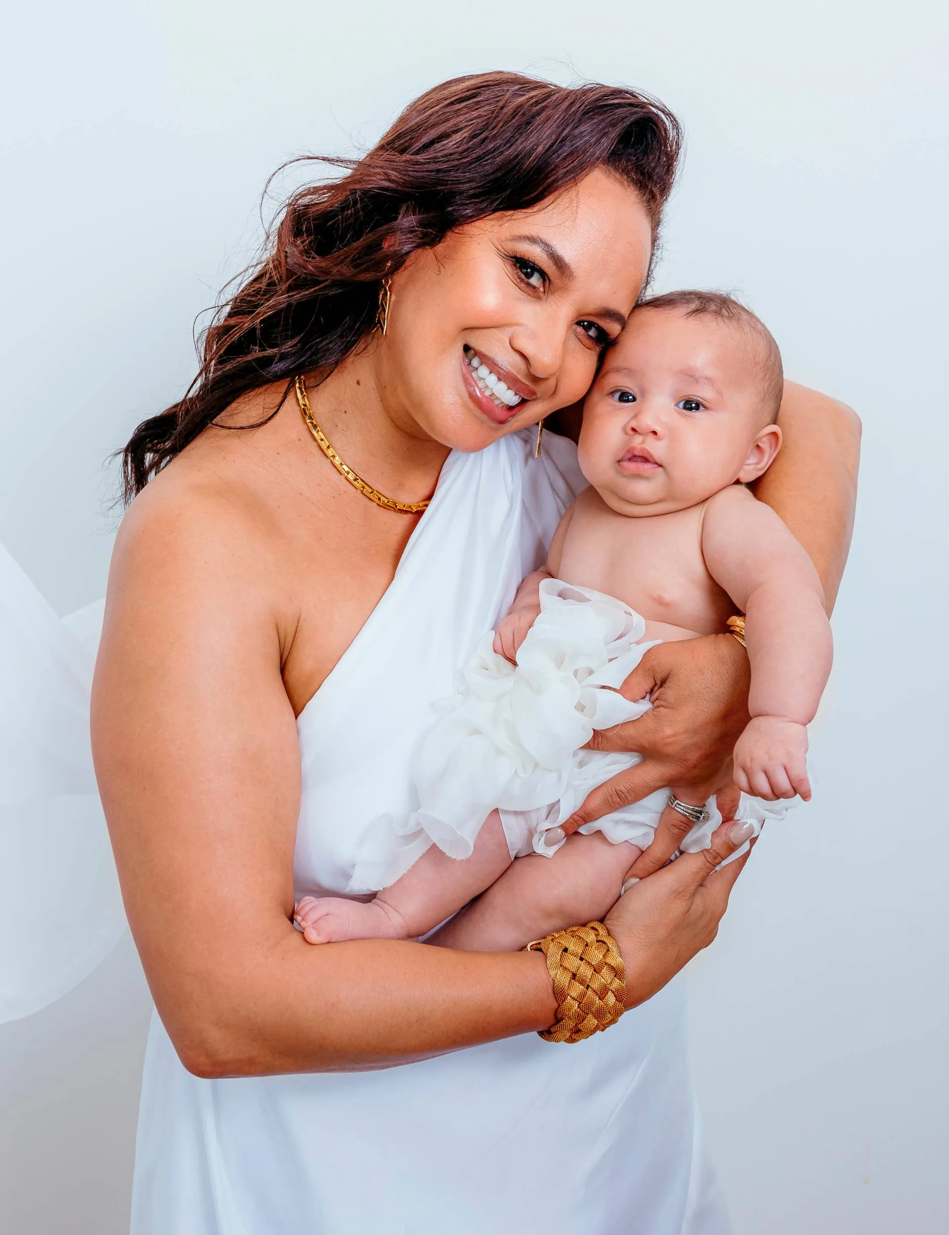 Megan Alatini cradling her granddaughter