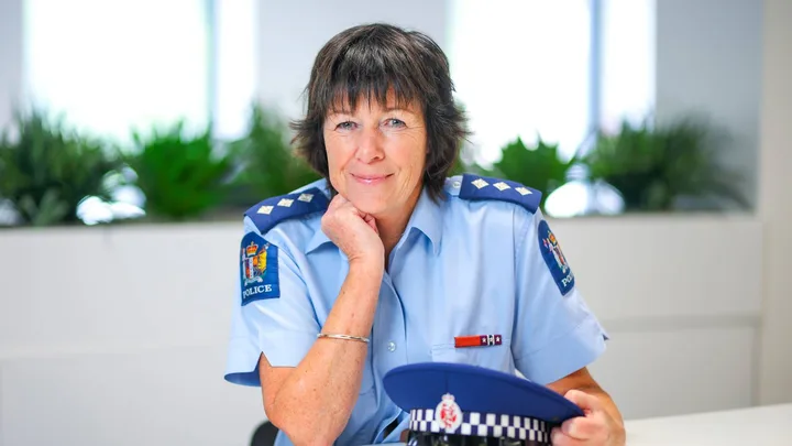 Female cop sitting at desk