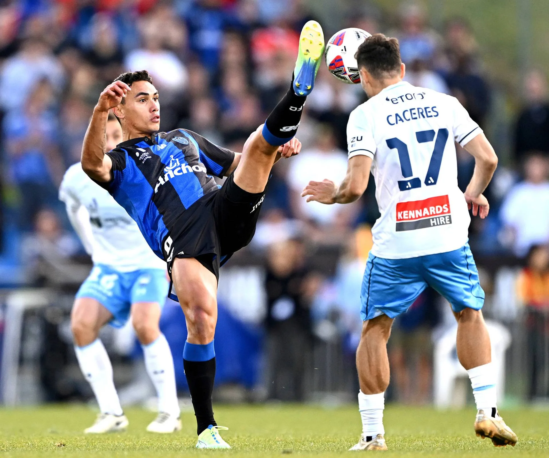 Max Mata kicking the all for the Auckland FC football team